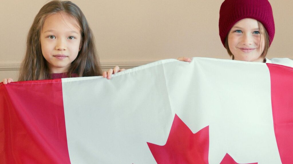 Two girls holding the Canadian flag - Century Private School BLOG - A Guide to Obtaining a Student Visa for Primary and Secondary School in Canada